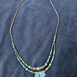 Southwest/Native American-style double-strand piece featuring turquoise-colored